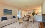 Stylish living room in a 4 bed, 2 bath apartment at Enclave at Pine Oaks with modern furnishings.