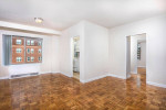 Spacious apartment interior with hardwood floors and large windows in Washington, DC