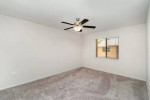 Renovated two bedroom apartment interior with ceiling fan and large windows at Park at Murano, Fort Myers.
