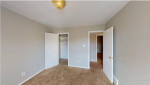 Spacious bedroom in El Dorado Apartments with updated flooring and neutral paint in Memphis.