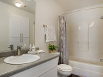 Bright bathroom featuring modern fixtures, a spacious countertop, and a relaxing atmosphere in a Pearl, MS apartment.