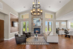 Cozy community lounge at The Lodge at Woodlake Apartments with fireplace and modern decor