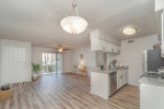 Bright and inviting interior of a charming 1x1 apartment with modern kitchen and living area.