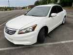 2012 Honda Accord LX-P in white, parked in a lot, showcasing its sleek design and shiny aluminum alloy wheels