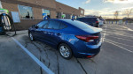 2019 Hyundai Elantra SEL parked at electric charging station, clean title, well-maintained, ready for sale.