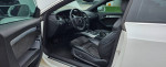 Interior view of a 2009 Audi A5 S-Line with black suede seats and sleek dashboard.