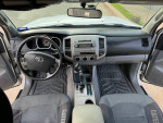 Interior view of a well-maintained 2008 Toyota Tacoma with automatic controls and cold air conditioning.