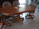 Oak Oval Pedestal  Dining room Table with 2 leaves.