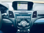 Interior view of a 2014 Acura RDX showing navigation system and audio controls