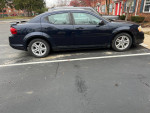 2012 Dodge Avenger SXT FWD, blue color, parked on asphalt, showing side view with alloy wheels.