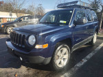 2012 Jeep Patriot 4x4 with clean body and large roof rack, parked in Newburgh, NY.