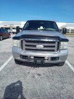 Front view of a clean 2005 Ford F-250 Diesel Lariat with low mileage for sale.