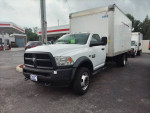 2017 Dodge Ram 4500 box truck for sale, showcasing its front view in a gas station setting.