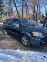 2014 Chrysler Town & Country minivan in great condition, black exterior, parked in a snow-covered area.