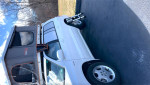 2005 Toyota Highlander Limited AWD with rooftop tent parked on asphalt, ideal for camping and outdoor adventures.