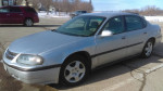 2001 Chevrolet Impala in silver metallic, a reliable everyday car with 185k miles for sale.