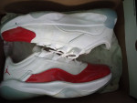 Red and white Jordan low top 11s Mens size 9/1/2