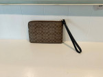 Coach Corner Zip Wristlet In Signature Canvas
