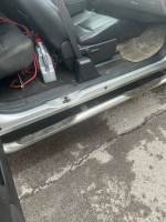 Interior view of a 2012 Chevrolet Silverado 1500 with leather seats and clean floor mats.