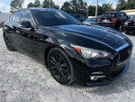 Black Infiniti Q50 sedan parked outside, showcasing sleek design and sporty look.