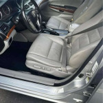 Interior view of a Honda Accord with leather seats and a clean finish, showcasing a spacious cabin.
