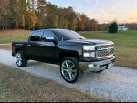 2015 Chevrolet Silverado 1500 Crew Cab 4x4 in excellent condition with black exterior and custom wheels