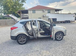 2015 Hyundai Tucson GLS parked with doors open, showcasing clean interior and exterior, available for $2300.