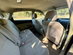 Interior view of a 2005 Toyota Prius hatchback showing rear seats and dashboard