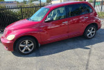 2006 Chrysler PT Cruiser Touring Wagon in red, showing side view with gray interior and 119058 miles.