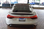 Rear view of a 2022 Audi e-tron GT Premium Plus, showcasing its elegant Ibis White exterior and sleek design.