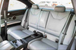 Interior of a 2008 BMW M3 coupe showing silver leather rear seats and center console details.