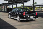 2001 Chevrolet Monte Carlo LS parked in a sunny area, showcasing its sleek black design and sporty features.