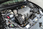 Engine compartment of a 2001 Chevrolet Monte Carlo LS with a V6 engine.