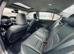 Interior view of a 2013 Honda Accord EX-L V-6 with leather seats and modern dashboard