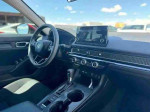 Interior view of a 2022 Honda Civic LX with modern dashboard and infotainment system, featuring Apple CarPlay.