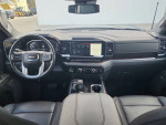 Interior view of the 2023 GMC Sierra 1500 showcasing modern dashboard and controls