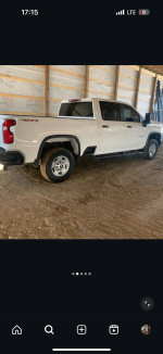 2020 Chevrolet Silverado 2500HD Custom parked inside a barn, showcasing its robust design.
