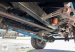 Underneath view of a 1991 Ford F-250 XL showcasing its solid engine and frame components.
