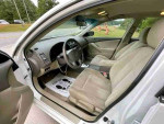 Interior of a 2008 Nissan Altima 2.5 with leather seats and clean layout, ready for driving.