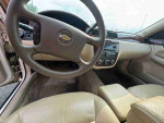 Interior view of 2012 Chevrolet Impala LS showing steering wheel and dashboard features.