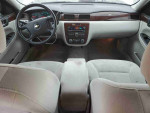 Interior view of a 2011 Chevrolet Impala LS showcasing dashboard and seating, ideal for daily commuting.