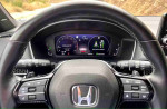 Interior view of the 2024 Honda Civic Sport dashboard showing speed and drive status displays.