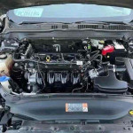 Under the hood of a 2013 Chevrolet Avalanche showing its clean engine and components.