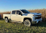 2024 Chevrolet Silverado 2500HD LT truck in good condition parked near cornfield.