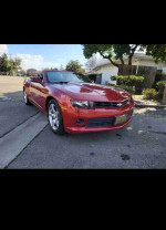 2015 Chevrolet Camaro LS in red, showcasing American muscle car design with 157K miles and clean title