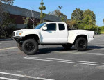 2020 Toyota Tacoma SR mid-size pickup truck with off-road capabilities parked in an open lot