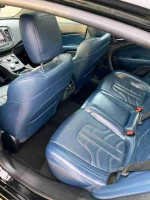 Interior view of 2016 Chrysler 200S with blue leather heated seats and navigation features.