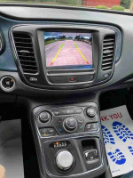 Interior of 2016 Chrysler 200S featuring navigation screen and controls