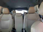 Interior view of 2021 Toyota Highlander Hybrid Platinum showing spacious seating and beige upholstery.