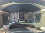 Interior view of the dashboard showing gauges and digital display of a 2016 Toyota Tacoma with 101,067 miles.